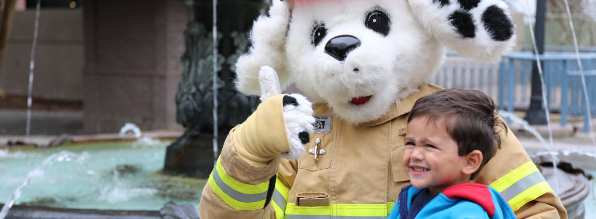 Firefighter teaching kids