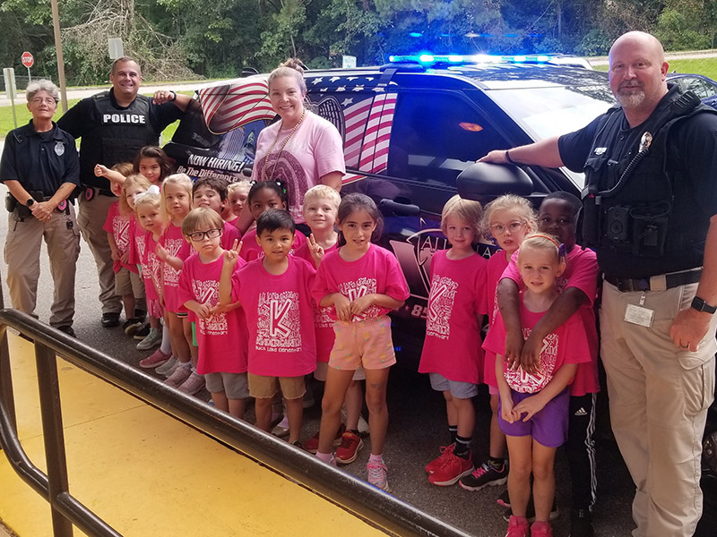 TPD officers with a group of young school kids.